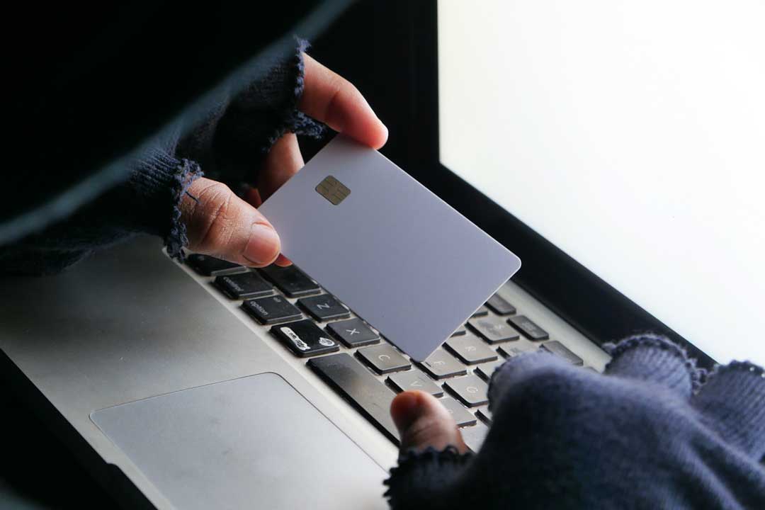 Fraudster-with-Card.jpg