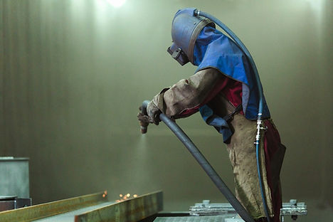 stock-photo-sandblast-blasting-metal-employee-prepares-metal-part-painting-harsh-man_edite
