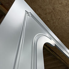 Detailed cabinet edge profile with smooth, spray-finished surface and crisp lines