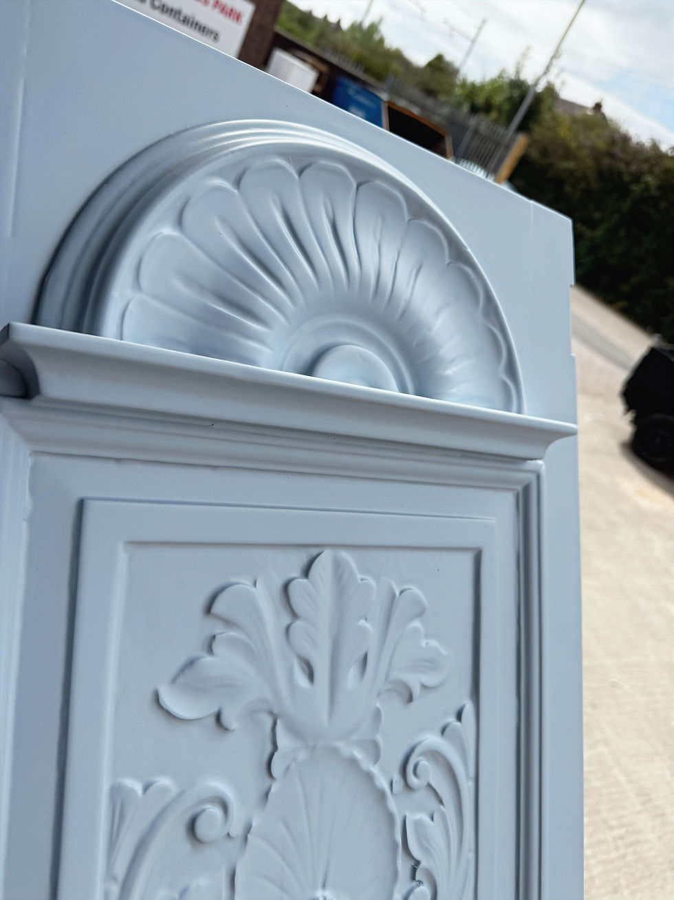 Decorative half-round carved panel on joinery, spray-finished with smooth coating and preserved detail definition