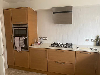 Before kitchen refinishing — original cabinetry and layout, Cardiff