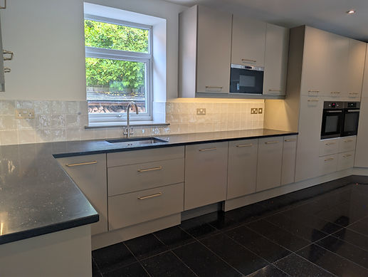 After: sink run refinished in Mouse’s Back with Jude Lichen tiles, timber skirting and antique brass details.