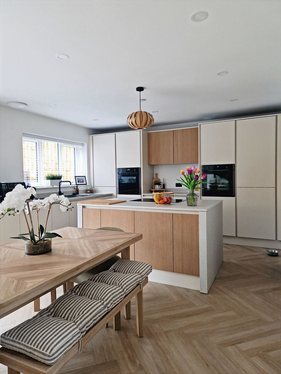Refinished kitchen with lighter cabinetry and updated tones, completed as a kitchen refinishing project in Cardiff