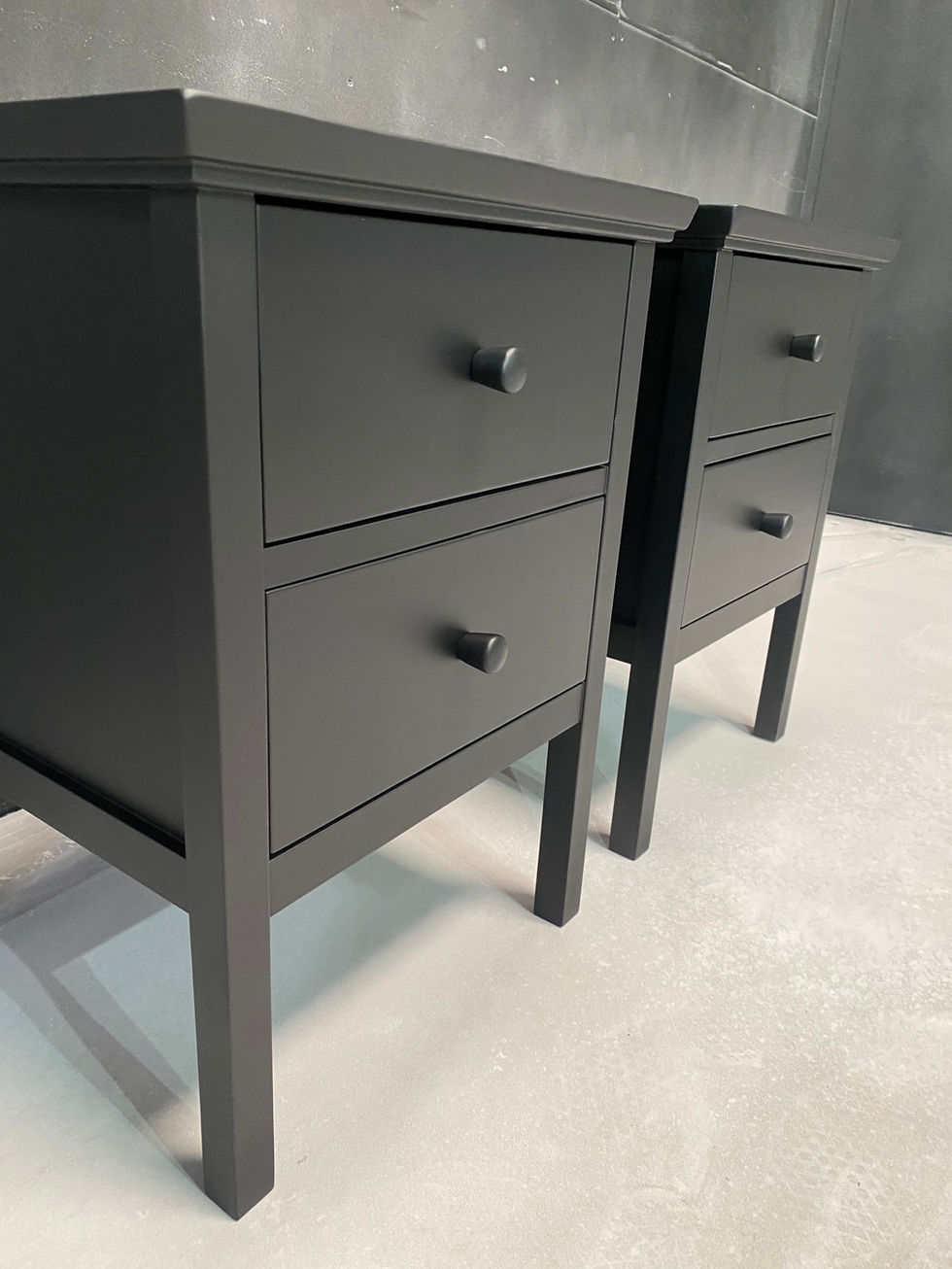 Black side table resprayed in matte finish with subtle detailing and modern lines.