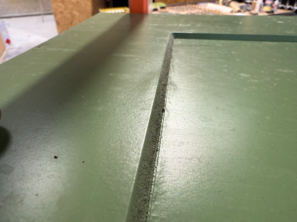 Kitchen cabinet paint finish with visible texture and uneven spray application close up