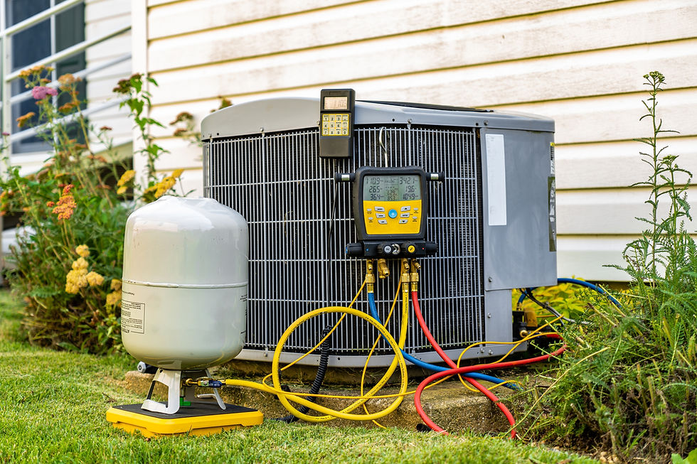 An old air conditioning unit that is being repaired by an HVAC service technician The tech