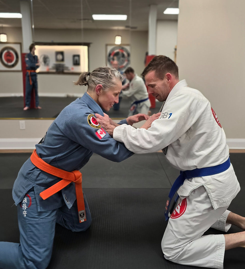 Woman practicing self-defense with a partner