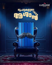 Blue armchair with a mustache, Malayalam text, and LUXUME logo