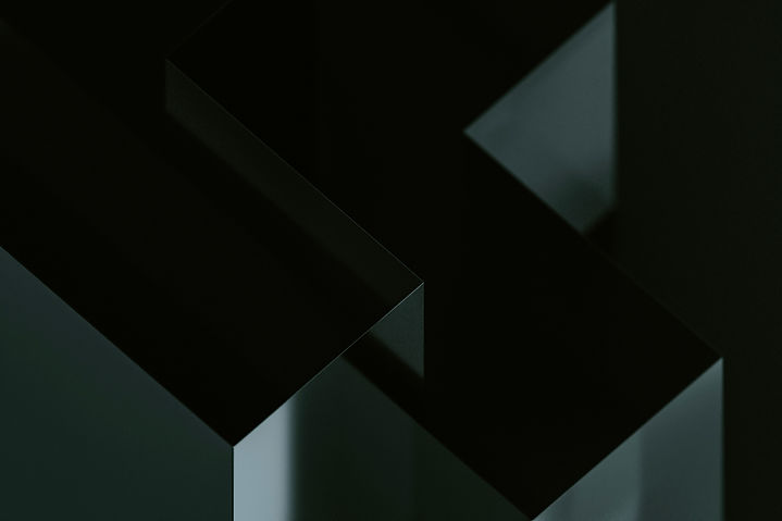 Geometric shapes are arranged in a dark composition._edited.jpg