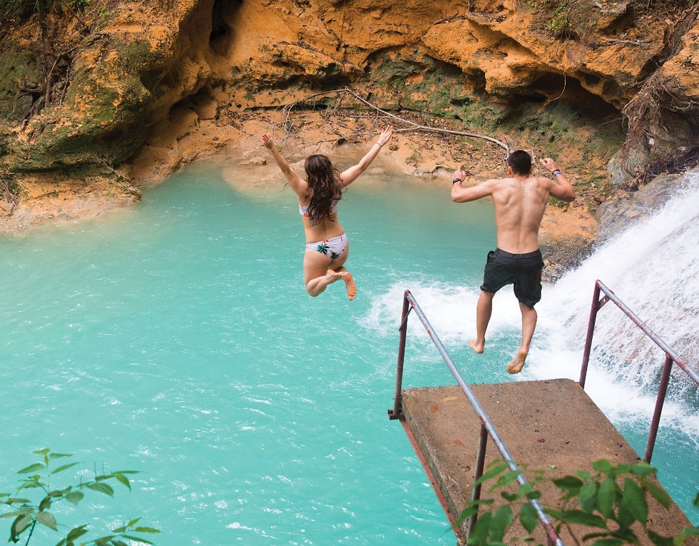 People jumping into lagoon