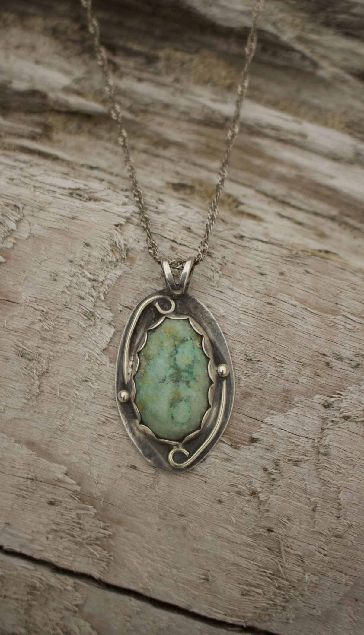Turquoise collected and cut by hand, set in sterling silver by Julia Simpson.