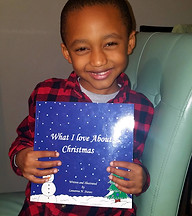Children with their copies of "What I Love About Christmas" book.