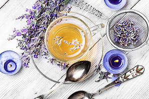 A steaming cup of lavender tea with dried lavender flowers, creating a calming ambiance.