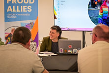 A trainer sat in front of a laptop