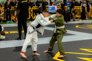 Youth jujitsu athletes competing at a tournament