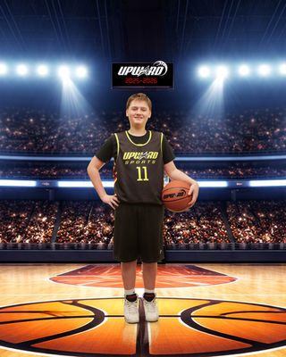 Upward basketball player number 11 holding a basketball in an arena portrait.