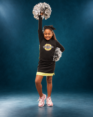 Upward cheer athlete with silver pompoms in a custom teal studio portrait