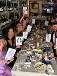Hen party holding up their caricatures by Alfie
