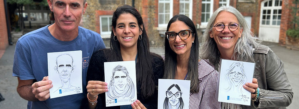 Staff members holding up their caricatures
