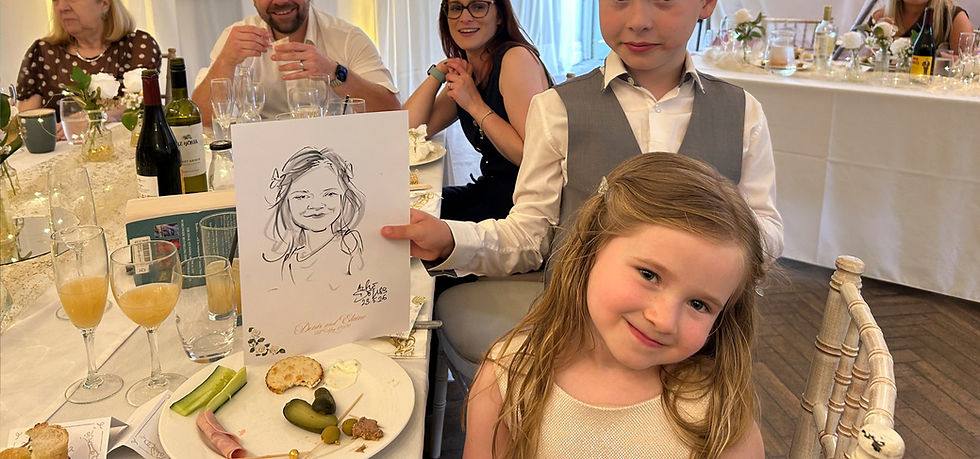 Six-year-old wedding guest having her caricature drawn at the table