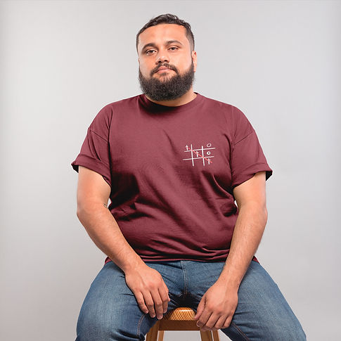 plus-size-t-shirt-mockup-featuring-a-man-with-a-beard-sitting-on-a-stool-20795.jpg