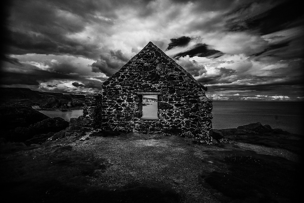 Ruined house on a coastal cliff in Scotland