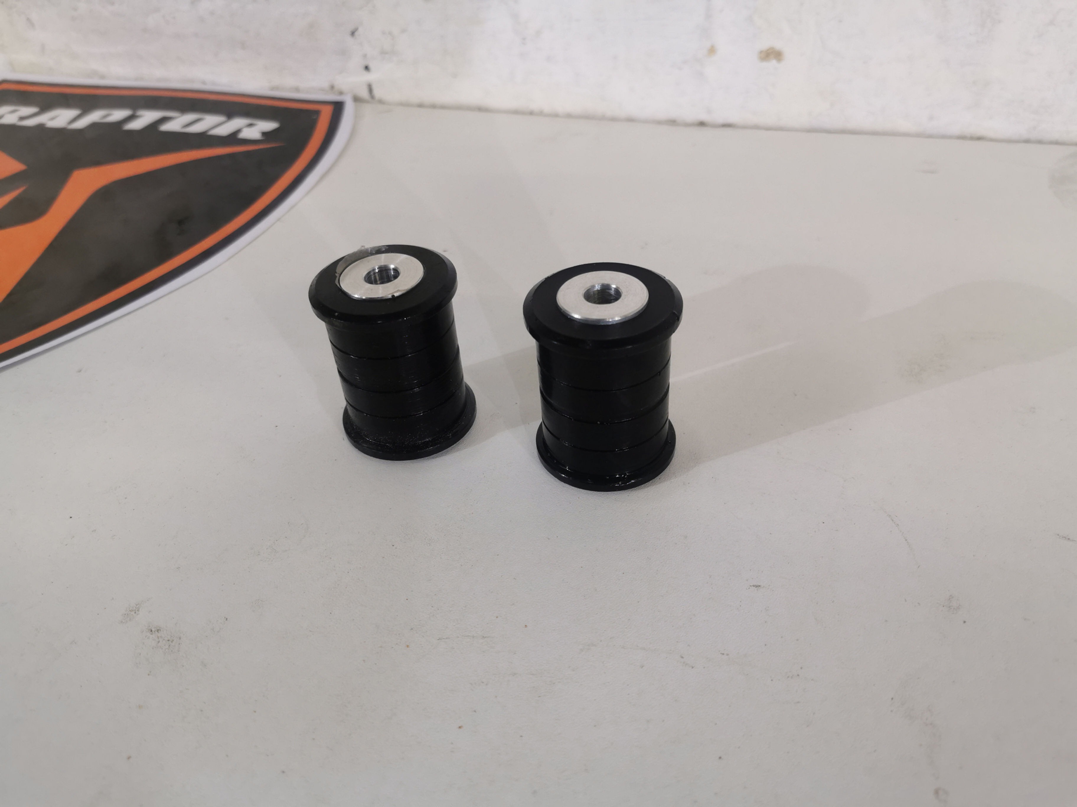 Upper rear camber adjuster bushes