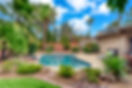 A luxury back yard with a pool .jpg