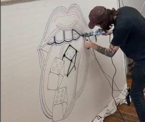 emmanuel audet tattoo artist designing classic mouth dice design for rug