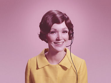 Woman with Telephone Headset ready to take calls