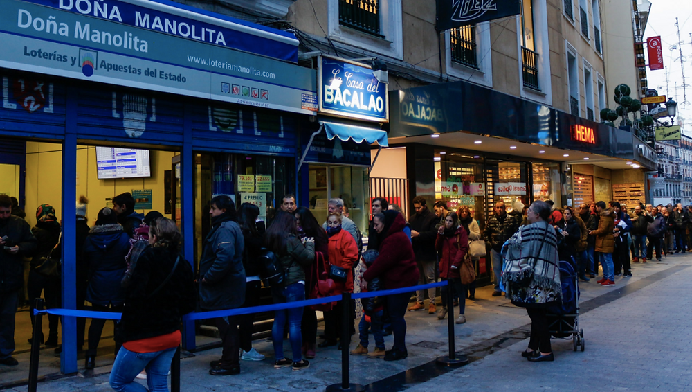 Hopeful people queuing to buy a Christmas Lottery ticket from Doña Manolita