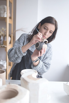 Woman Painting Pottery