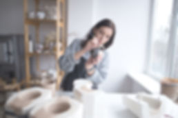 Woman Painting Pottery