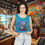 Thumbnail: Woman wearing Daytona Beach's Biketoberfest Tank Top, Women's Graphic Shirt for Bikers, smiling in store.