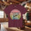 Thumbnail: Maroon t-shirt with fish graphic and Arizona text, Wolf's Den Clothing.