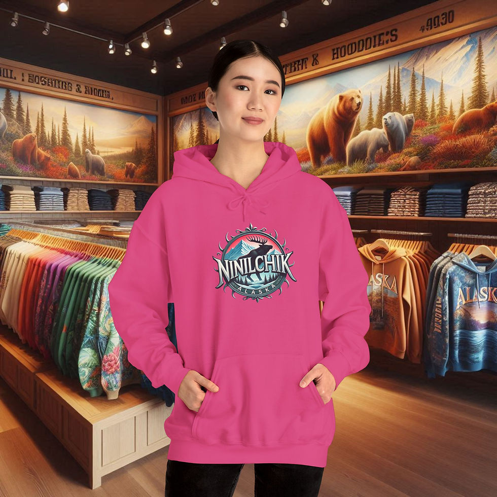 Thumbnail: Woman wearing pink Ninilchik hoodie, store background. Live Wild. Wear Ninilchik.