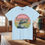 Thumbnail: Light blue t-shirt with 'Fish around and find trout' and FLORIDA. Wolf's Den Clothing.