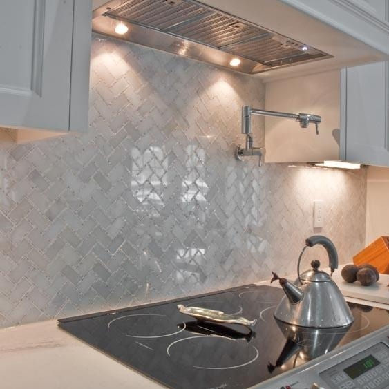 Thumbnail: Sometimes stone flooring makes all the difference in the world, like this herring bone glacier and carrara micro dots