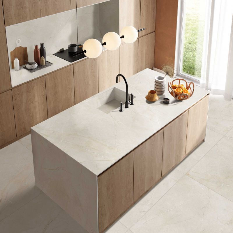 Thumbnail: matte finish porcelain style installed as kitchen backsplash and countertop, complimenting the pale wood cabinets