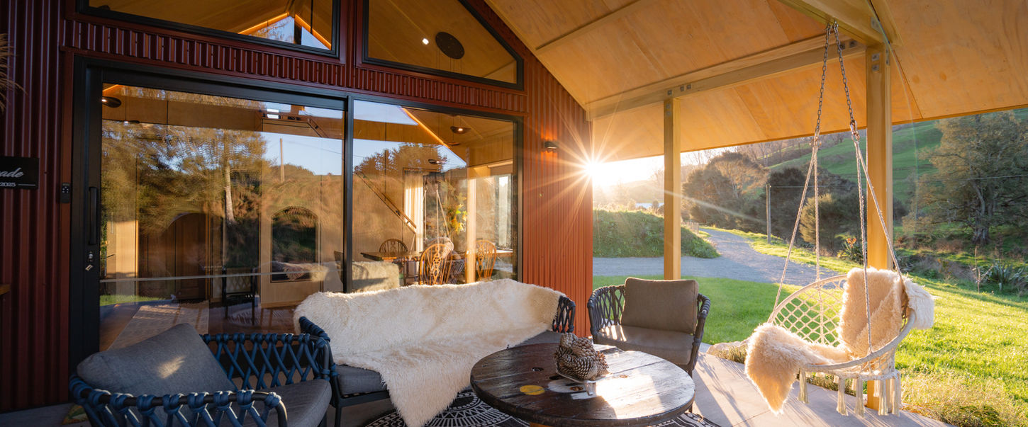 Luxury cabin interior with open views over the countryside at Ripples Retreat near Waitomo, New Zealand.