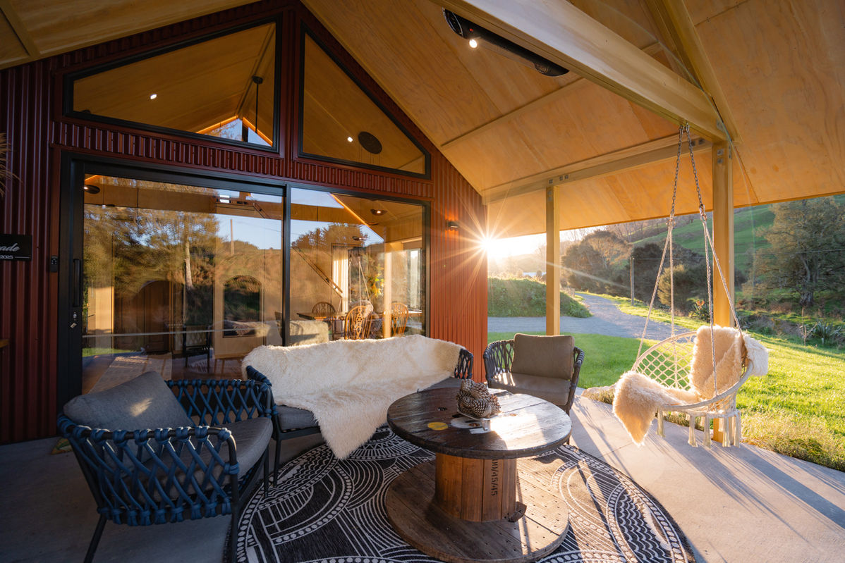 Luxury cabin interior with open views over the countryside at Ripples Retreat near Waitomo, New Zealand.