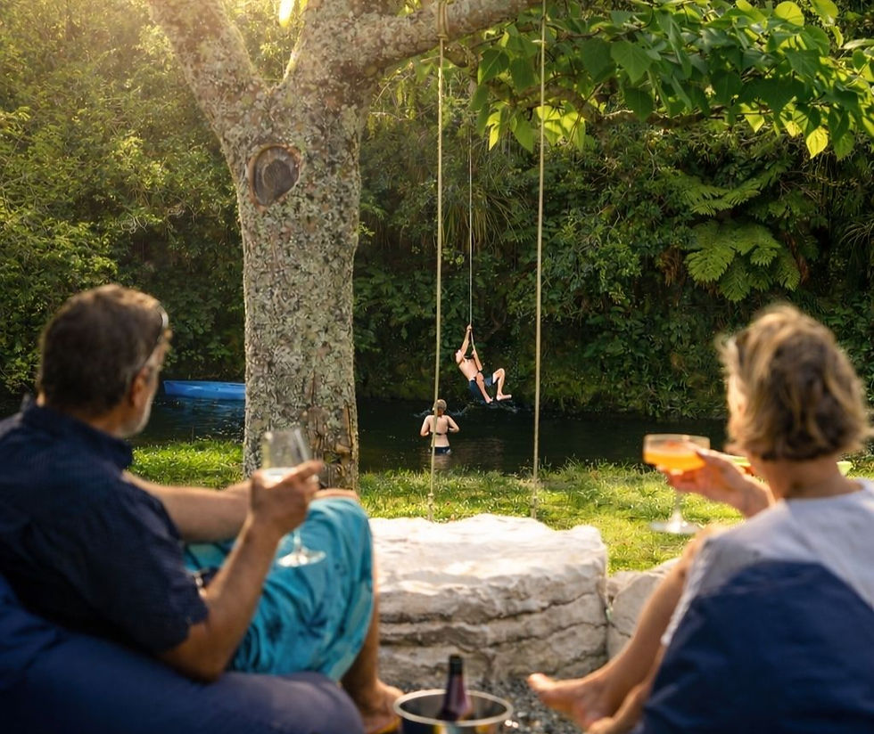 Guests relaxing on the deck at Ripples Retreat whilst watching their children play in the river pool