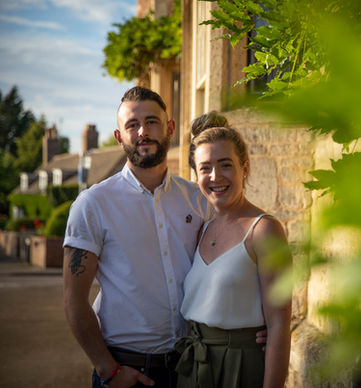 couple next to a building