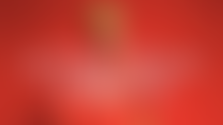 A person in sitting confidently on a white fur stool. While wearing a red top with the letters l o v e across the front. with long red socks in red lighting. The background features a red vignette gradient. No visible text.