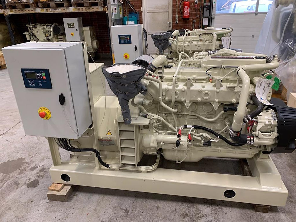 Large industrial engine with control panels in a workshop. Beige machinery is idle on a concrete floor with shelves and fire extinguisher behind in Miami, FL.