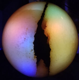 Laminated layers of Brazilian green onyx and Belgian black marble with a green onyx dome. Illuminated with programmable colored LEDs.
28" T x 8" W x 8" D  