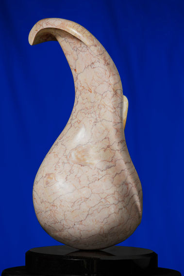 Crema marble from Spain with Honeycomb calcite stamen.
24" T x 12" D x 10" W 
on a 15" oval black granite base.