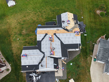 Aerial photo of a roof repair in progress of a house in Chaska, MN