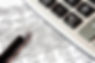Bookkeeping and accounting data with calculator and pen