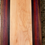 Thumbnail: Handmade hardwood cutting board showing maple center with padauk, purpleheart, and walnut edge detail